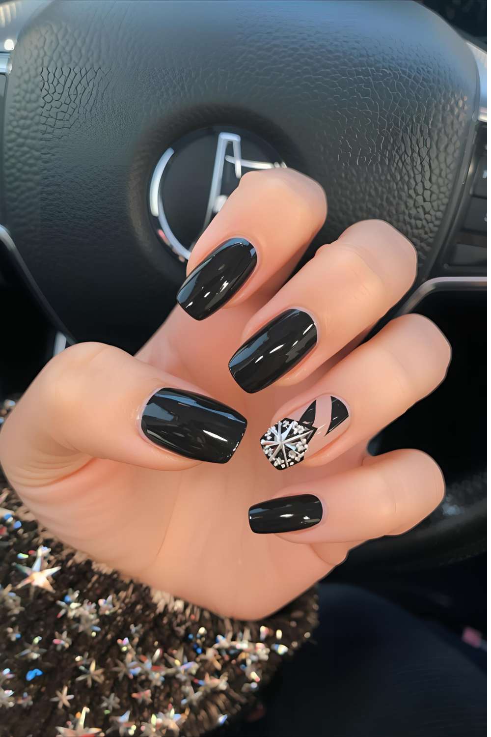 Black-New-Year-nail- design-featuring- glossy-black-nails-with-one-accent-nail- decorated-with-festive -nail-art.