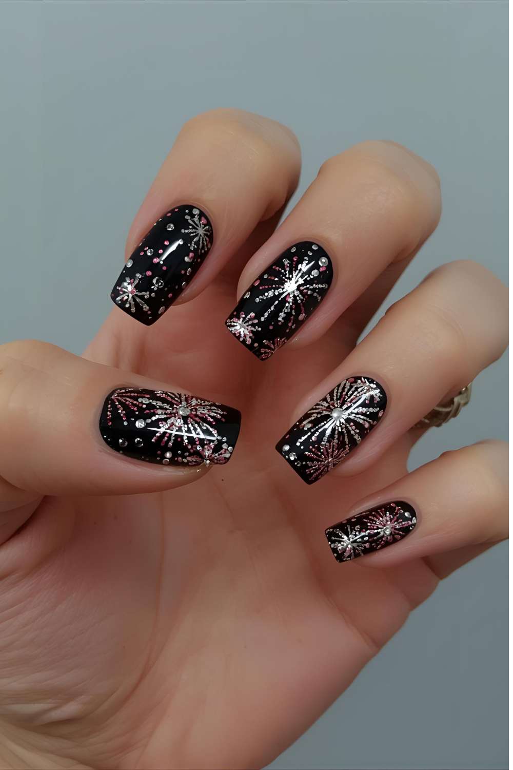 fireworks-nail-art-featuring-colorful-burst-designs-on-glossy-nails-for-a-festive-celebratory-look.