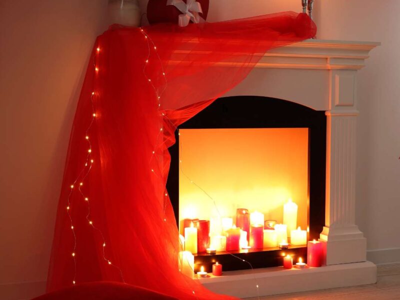 Stunning-Valentine’s-Day-room-decor-with-red-floral-arrangements-candles-and- soft-glowing-lights-for-a-romantic-surprise.