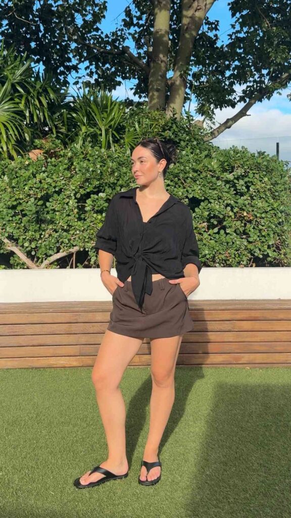 Style-Your-Black-Shirt-With-a-Midi-Skirt-for-a-Feminine-Look-That-Balances-Edge-With-Softness