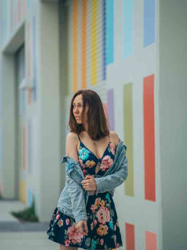 Wear-a-Floral-Midi-Dress-With-a-Denim-Jacket-and-White-Sneakers