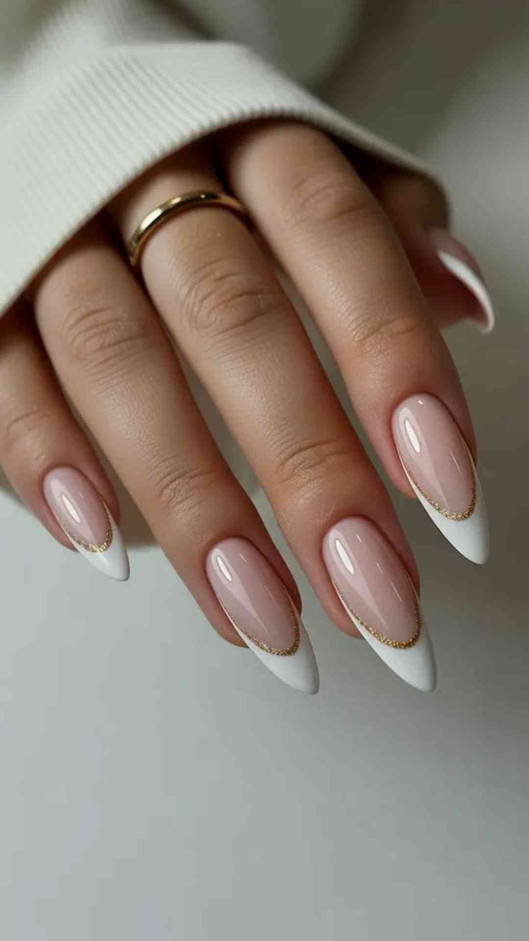White-French-Tips-With-Tiny-Gold-Accents-Along-the-Smile-Line-That-Add-Subtle-Shimmer-and-Spring-Elegance