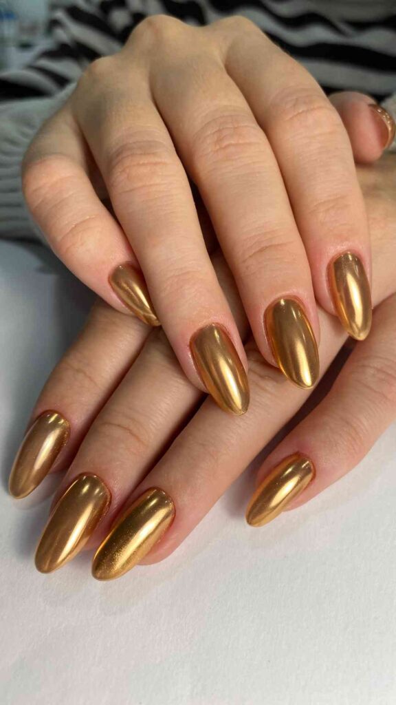 Yellow-Chrome-and- Metallic-Almond-Nails-A-Futuristic-Finish-That-Makes-Your-Nails-Glow-Like-Gold