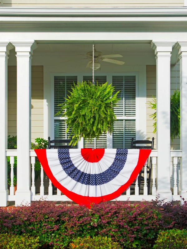 Drape-Red-White-and-Blue-Bunting-Along-Your-Porch-Railing-for-a-Classic-Patriotic-Look-4th-of-July-Porch-Decor-Ideas