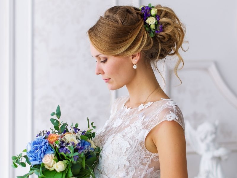 Bride-to-be-featuring-a-beautiful-curly-updo-wedding-hairstyle-with-soft-curls-elegant-volume-and-a-timeless-bridal-look.