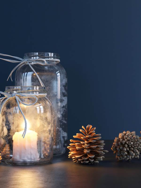 diy-craft-of-mason-jar-lanterns-with-candlelight-inside-and-fabric-bow-ties-around-the-jar-top