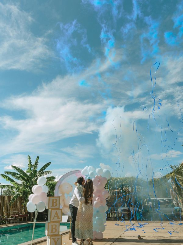 couple-at-a-beach-filled-with-blue-smoke