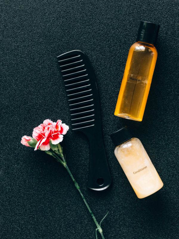 display-of-a-comb-flower-and-two-hair-moisturizers