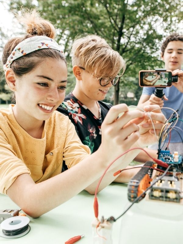 teens-setting-up-cameras-for-outdoor-activities-for-teens